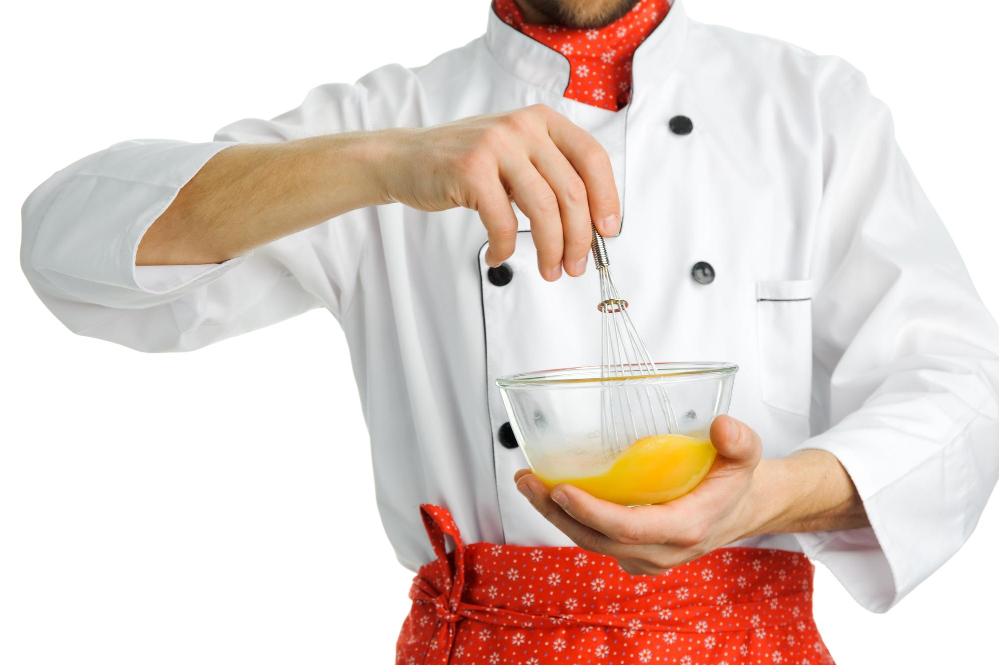 Instructor demonstrating plating with futuristic kitchen tools